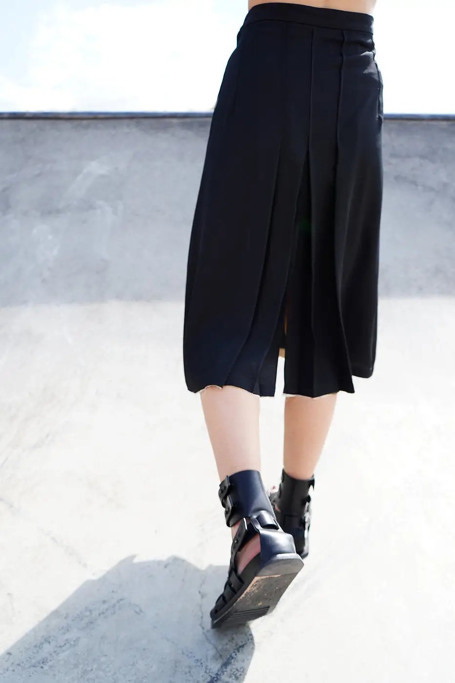 Chic black midi skirt with a unique blend of classic and contemporary style by Winnie Witt.