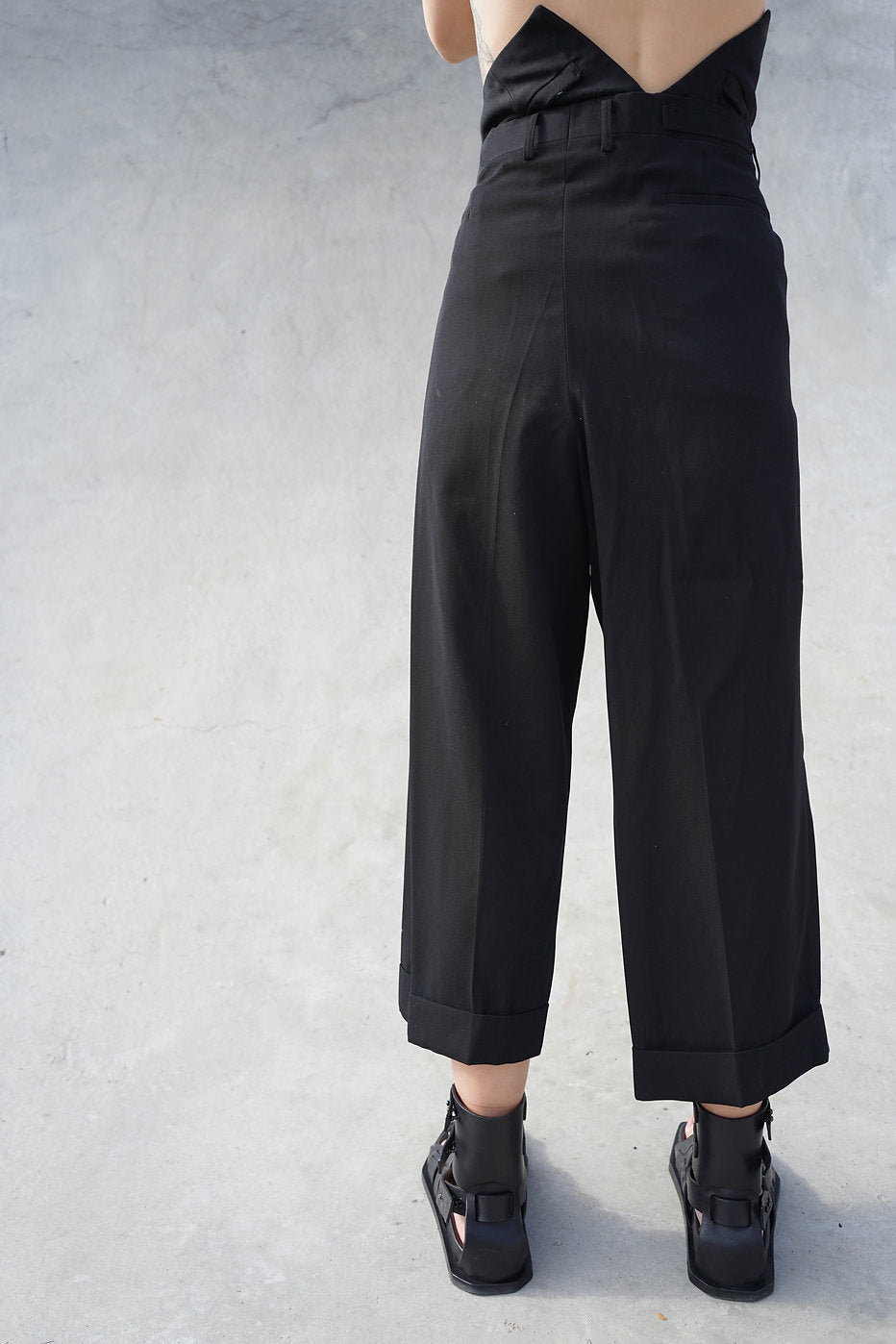 Black cropped pants by Winnie Witt, perfect for a high-end, modern wardrobe.