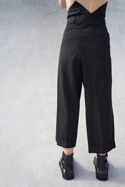 Black cropped pants by Winnie Witt, perfect for a high-end, modern wardrobe.