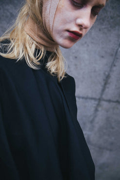 Elegant black viscose Deconstructed Dress by Winnie Witt, showcasing a versatile sleeve design.